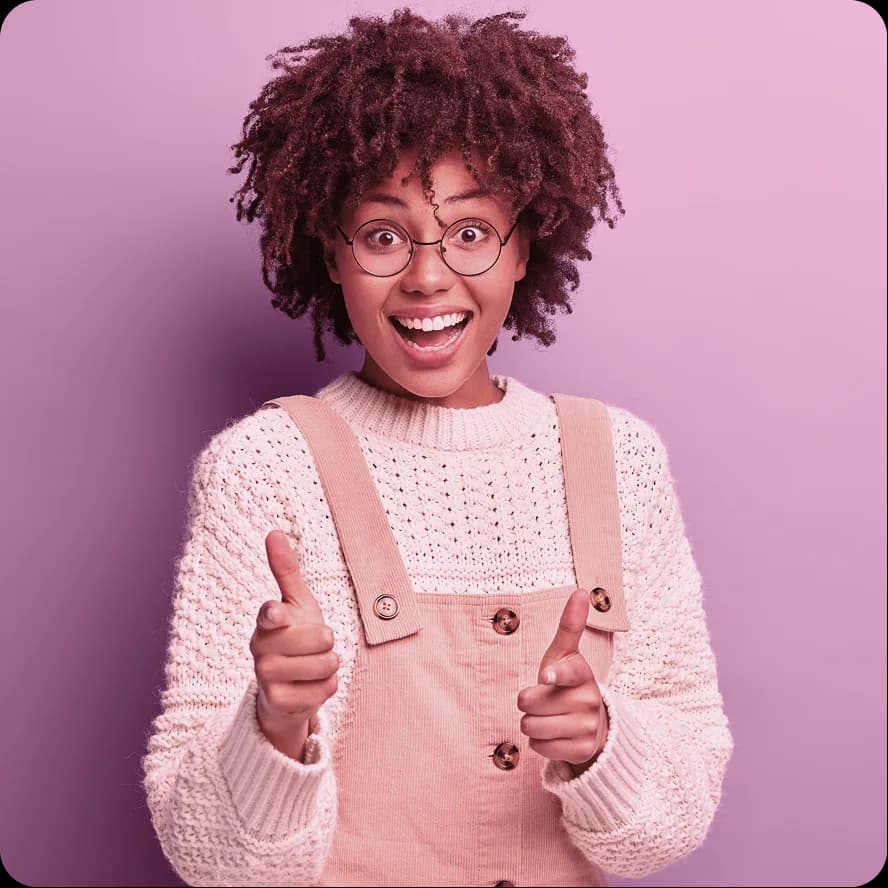 Delighted fashion artisan against a pink backdrop